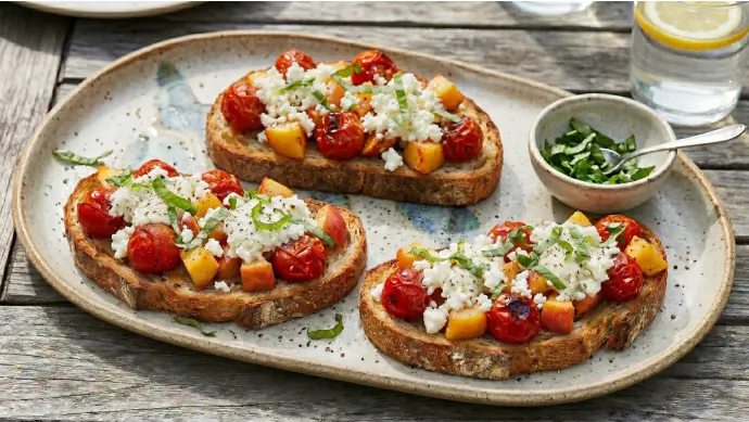 Buffalo Mozzarella Toasts with Roasted Tomatoes and Fruit